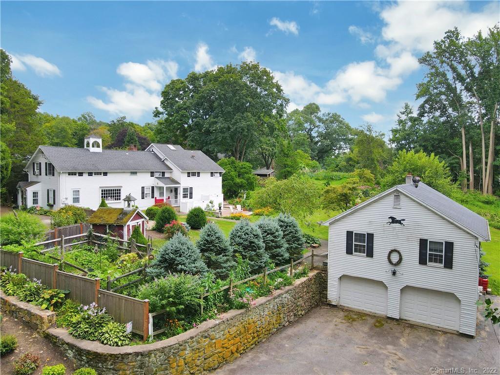 19 West Mischa Road Trumbull, CT 06611 - Photo 1 of 1 an aerial view of white house with a yard and potted plants