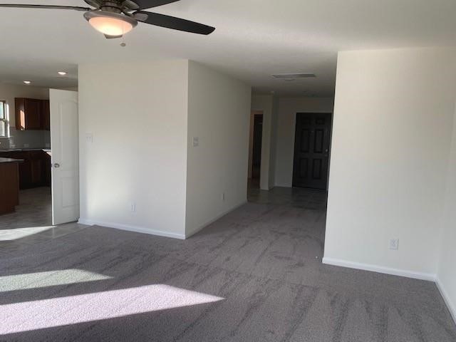 727 Hardwood Grove Houston, TX 77090 - Photo 17 of 26 a view of a livingroom with a ceiling fan and window