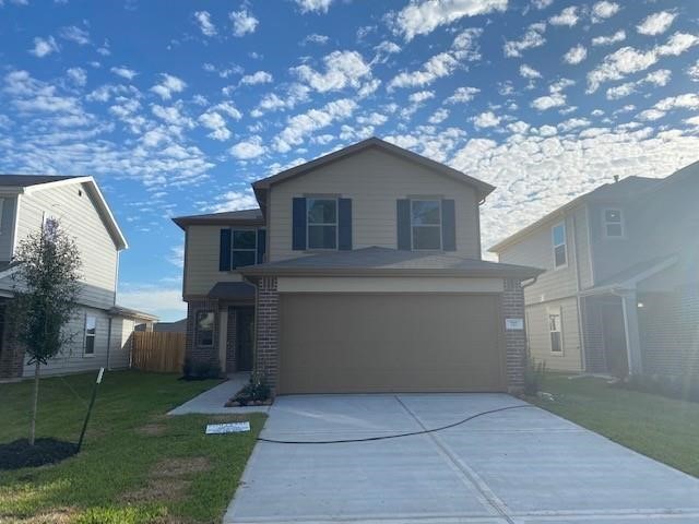 727 Hardwood Grove Houston, TX 77090 - Photo 2 of 26 a front view of house with yard and trees in the background