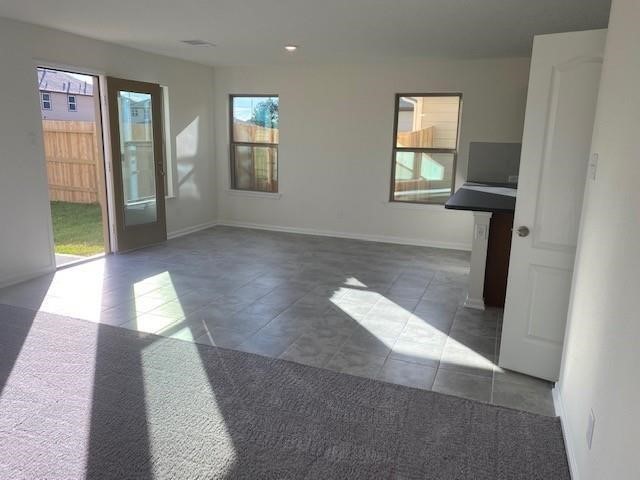 727 Hardwood Grove Houston, TX 77090 - Photo 21 of 26 wooden floor with windows and chandelier