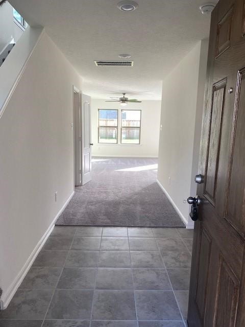 727 Hardwood Grove Houston, TX 77090 - Photo 4 of 26 a view of hallway with windows and chandelier