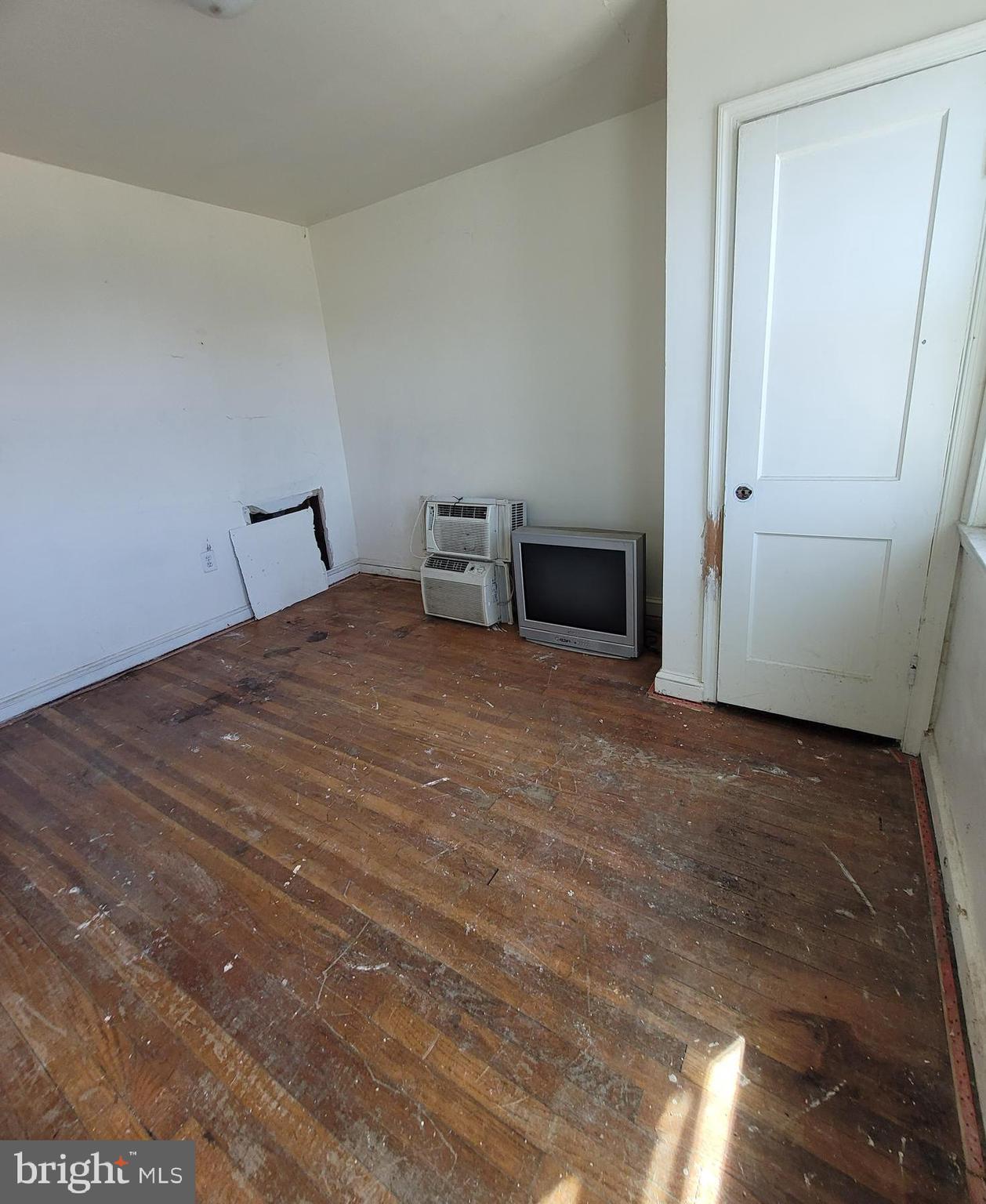2930 Sollers Point Road Dundalk, MD 21222 - Photo 5 of 12 a bedroom with a bed and cabinets