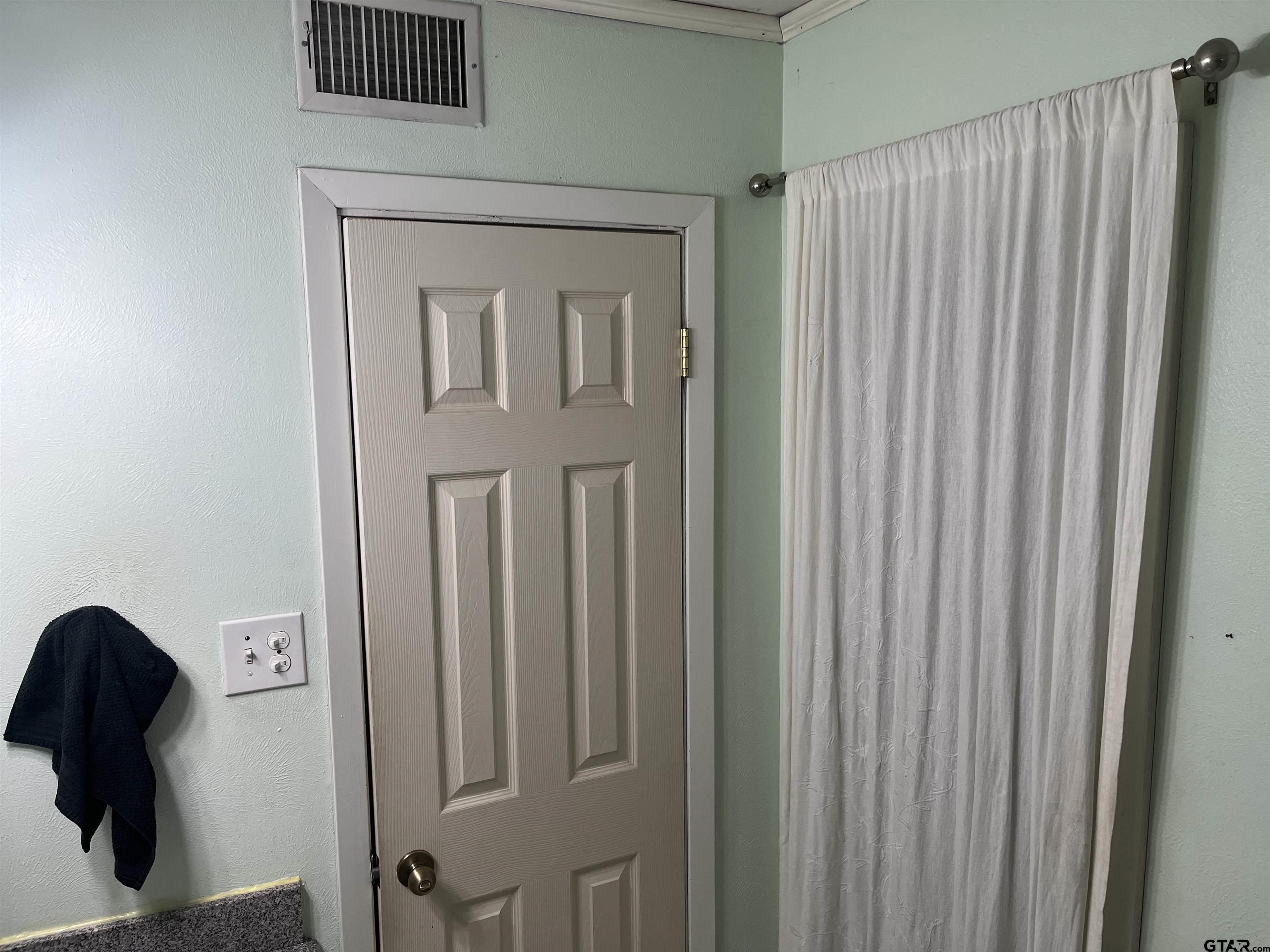 407 Fulton Street Pittsburg, TX 75686 - Photo 18 of 30 a view of wooden door