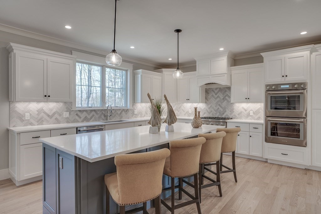 24 Damon Road Needham, MA 02494 - Photo 8 of 38 a kitchen with a center island appliances and cabinets
