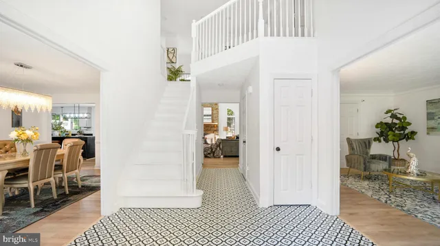 a view of a hallway with dining area
