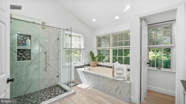 a very nice looking room with a large window and chandelier