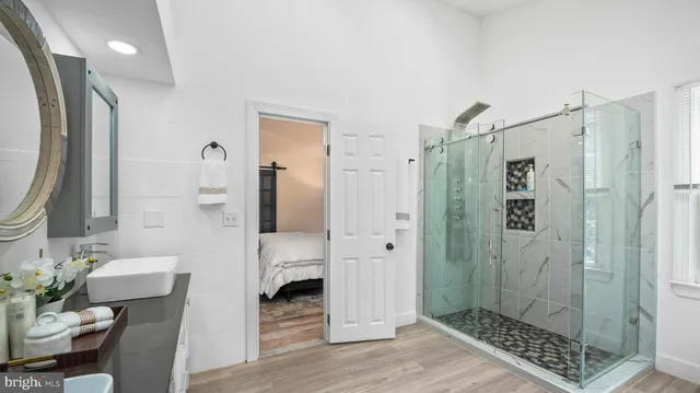 a bathroom with a shower and a sink