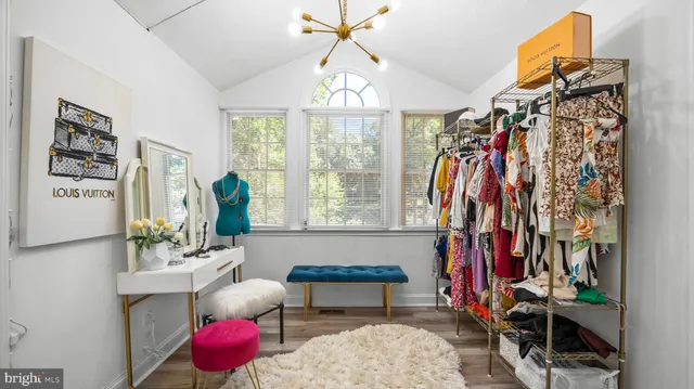 a living room filled with furniture and a chandelier