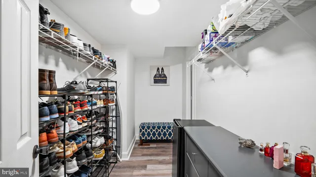 a view of entryway with a lot of stuff and cabinets