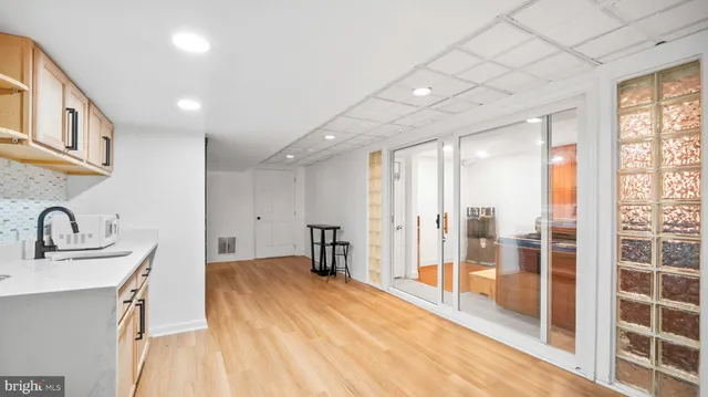 a bathroom with a sink and a large mirror