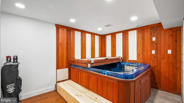 a kitchen that has a sink and a wooden floor
