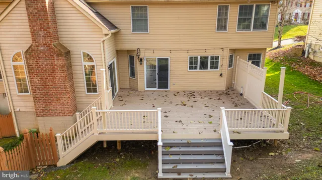 a view of front door of house with stairs