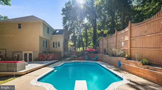 a swimming pool with outdoor seating