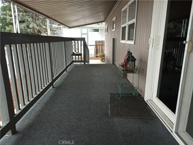 a view of a balcony with chairs