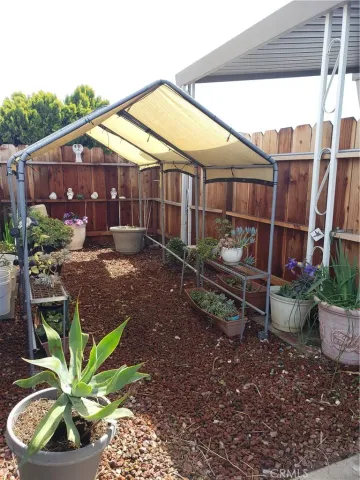 a view of a garden with sitting area