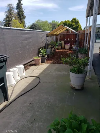 a view of a garden with sitting area