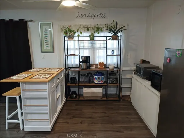 a kitchen that has a stove and a table in it