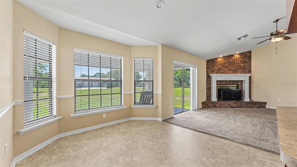 8525 North Campbell Road Lakeland, FL 33810 - Photo 33 of 45 a view of an empty room with a fireplace and a window