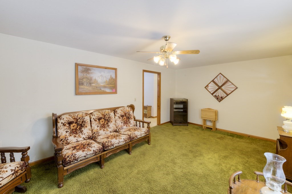 123 Springfield Street Three Rivers, MA 01080 - Photo 21 of 36 a spacious bedroom with a bed and a chandelier