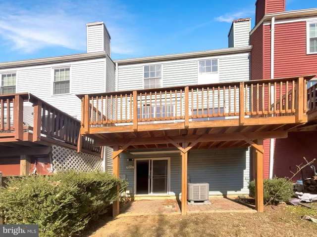 a front view of a building with glass windows and door