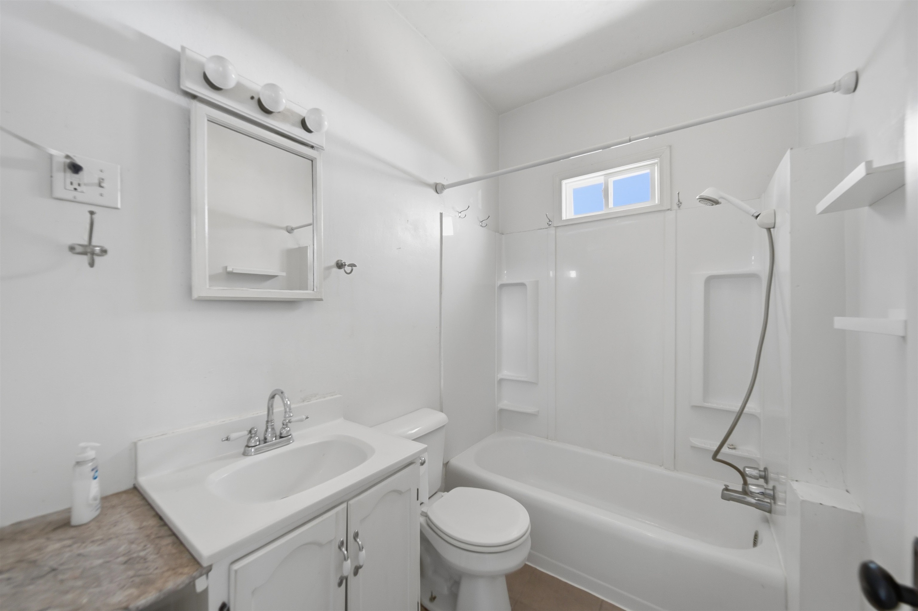 324 East 2nd Street Dixon, IL 61021 - Photo 11 of 25 a bathroom with a sink toilet and shower