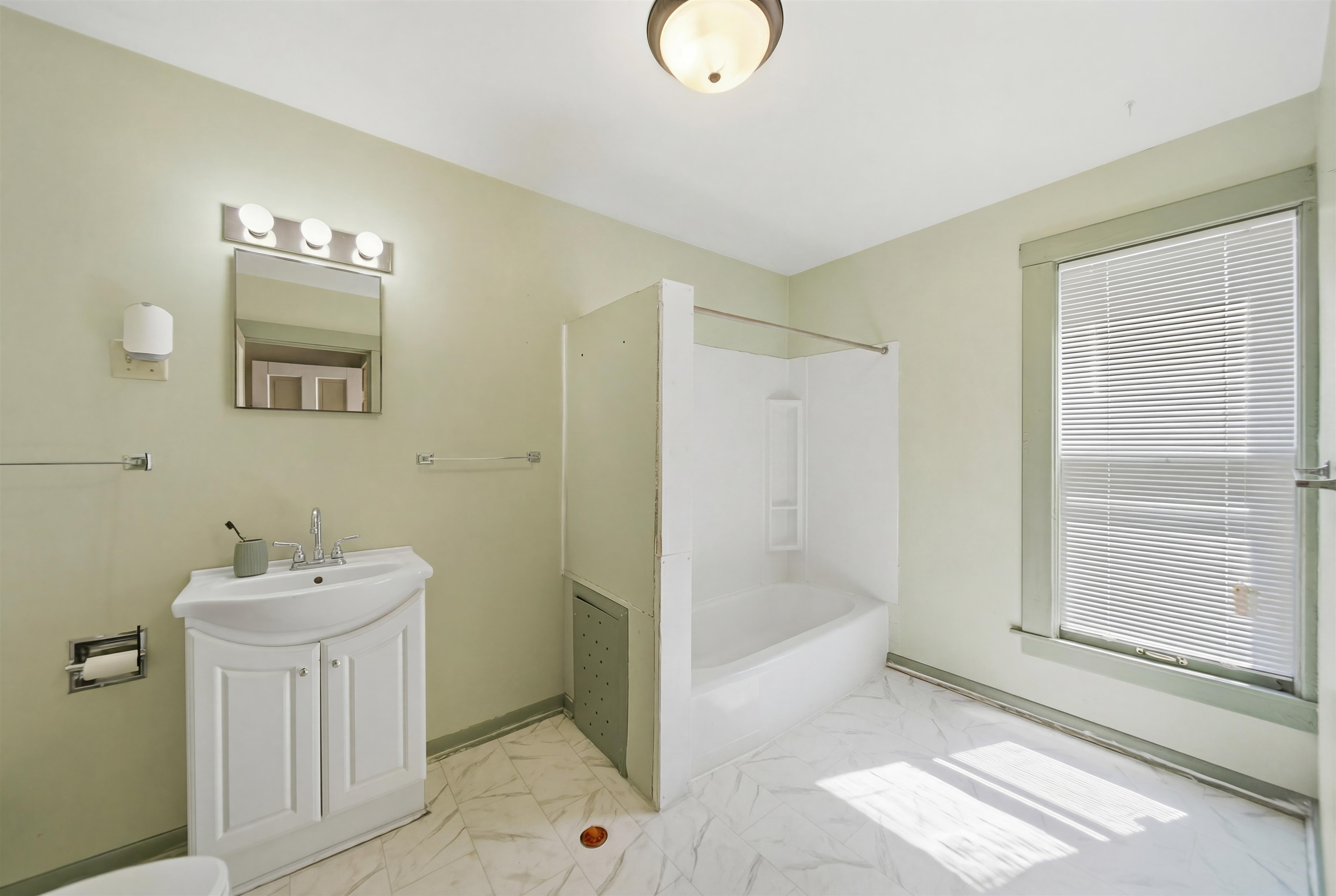 324 East 2nd Street Dixon, IL 61021 - Photo 18 of 25 a bathroom with a sink a toilet and shower