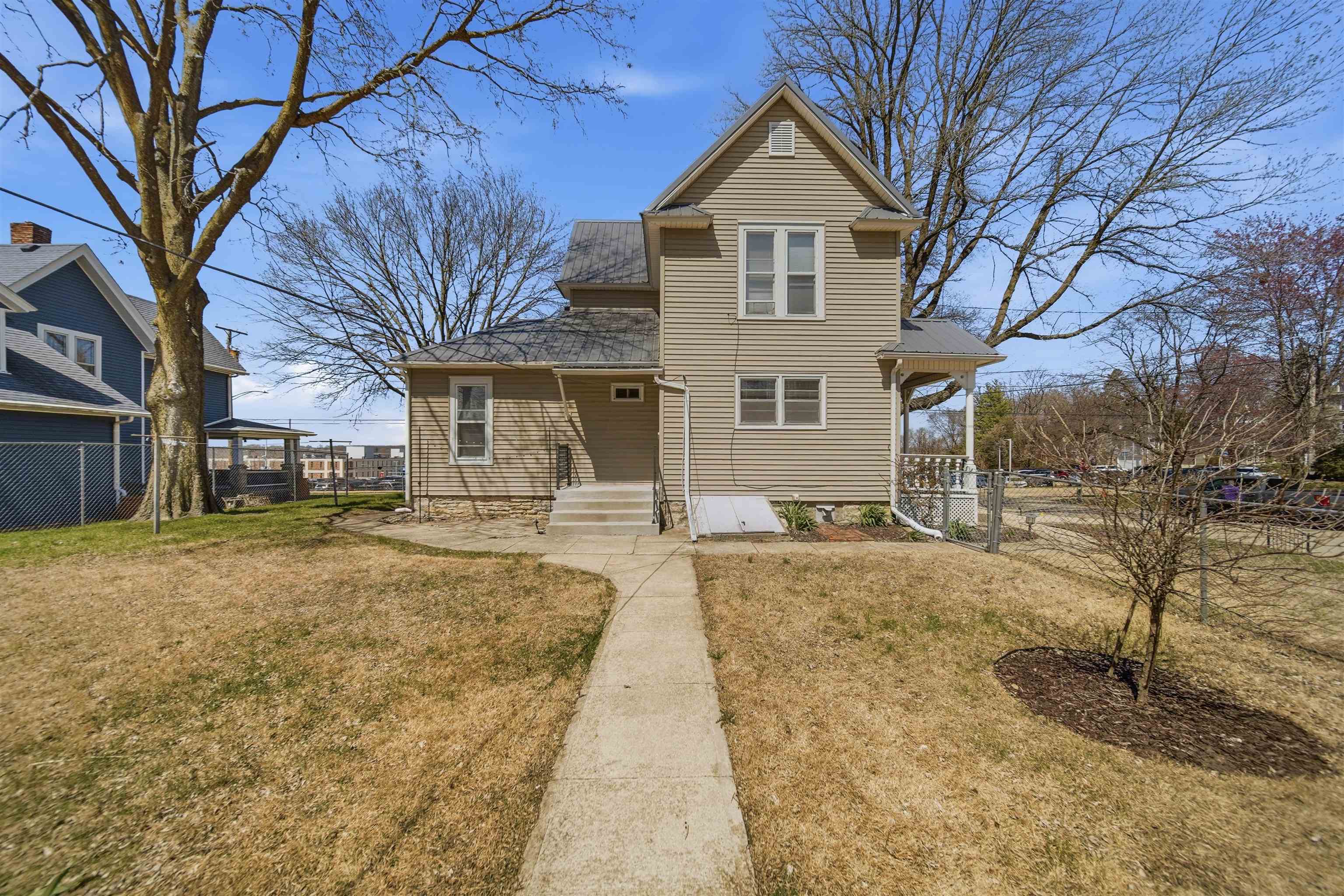 324 East 2nd Street Dixon, IL 61021 - Photo 22 of 25 a front view of a house with a yard