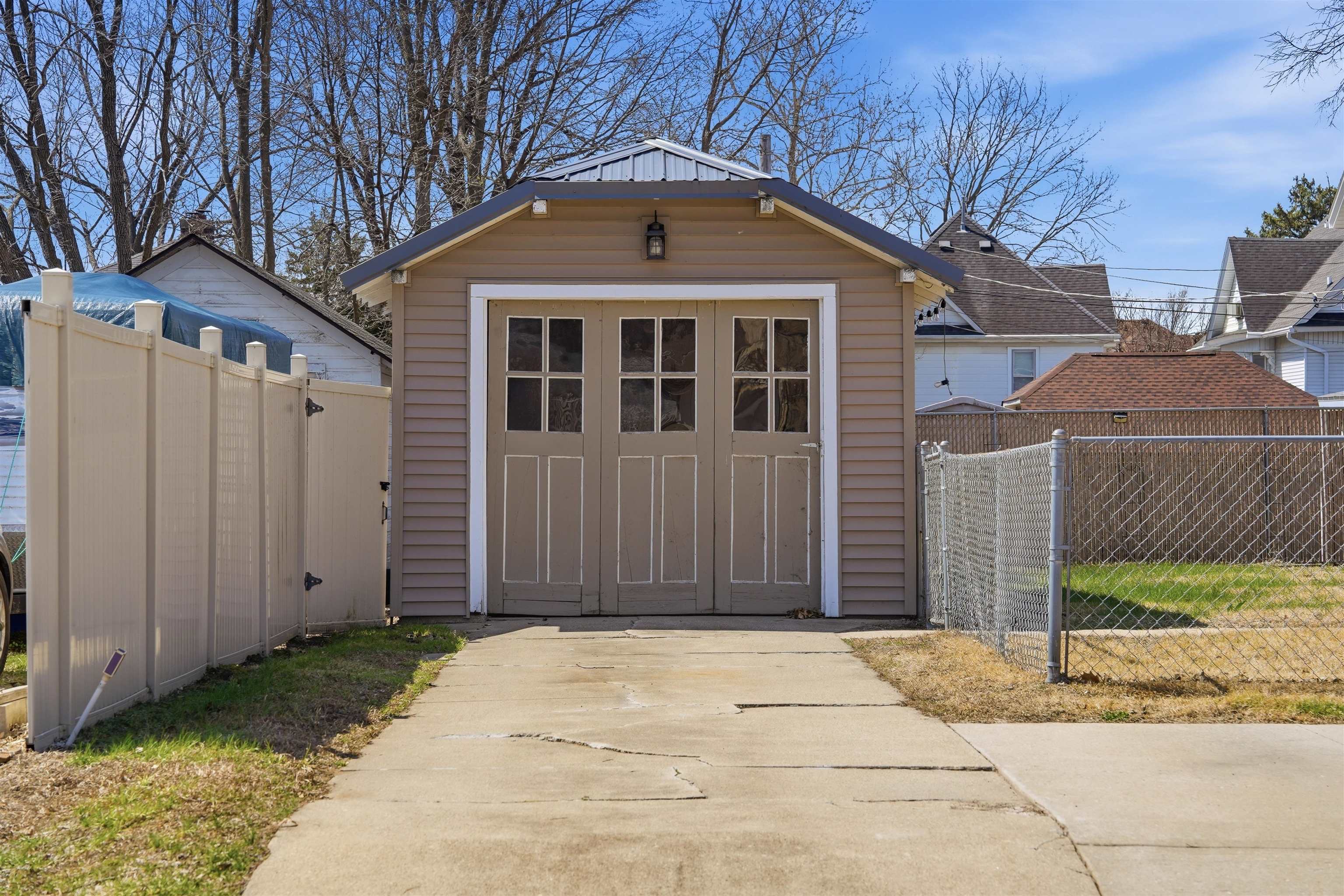 324 East 2nd Street Dixon, IL 61021 - Photo 4 of 25 a front view of a house with a yard