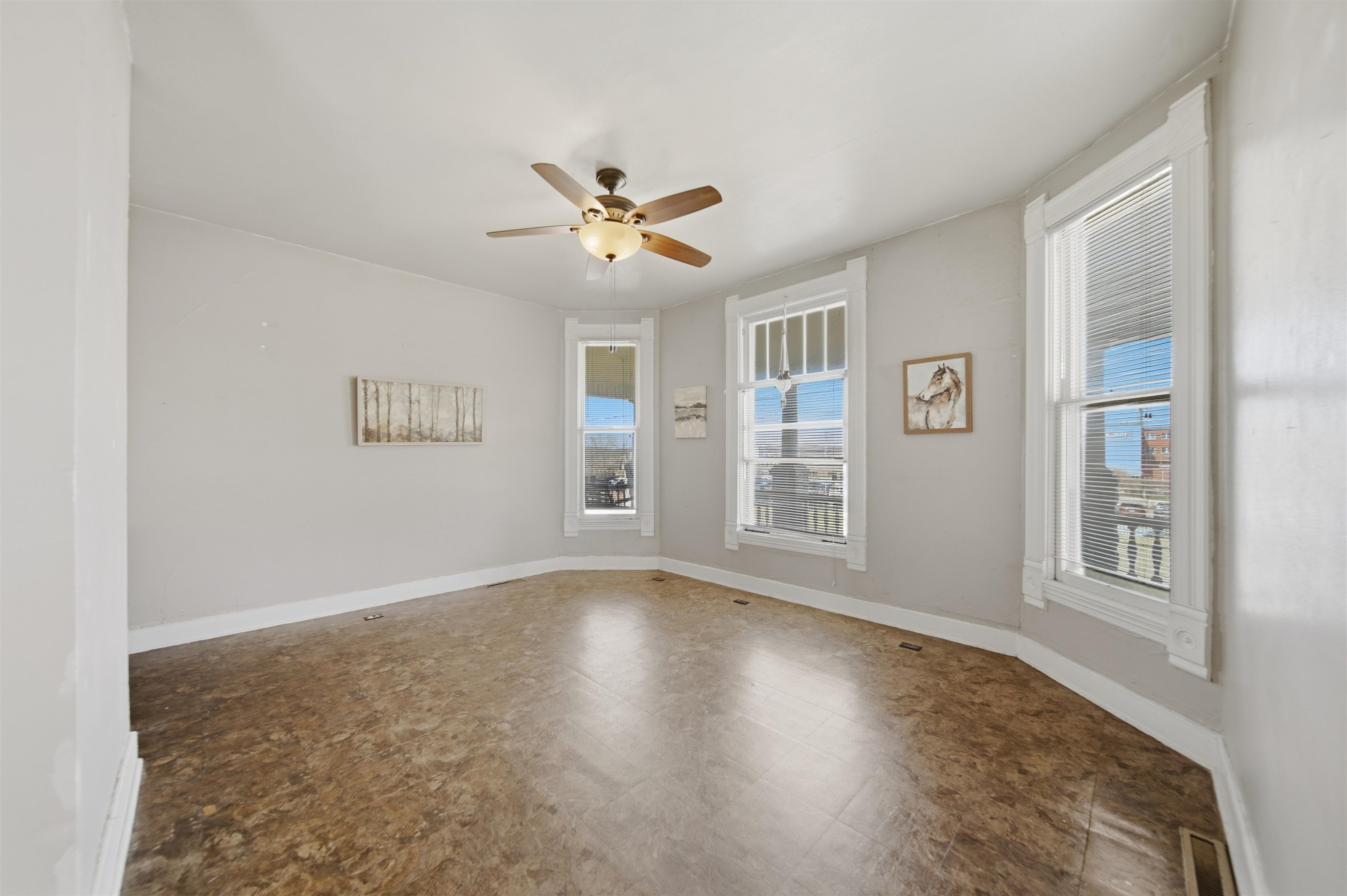 324 East 2nd Street Dixon, IL 61021 - Photo 7 of 25 a view of empty room with wooden floor and fan
