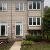 a front view of a house with yard