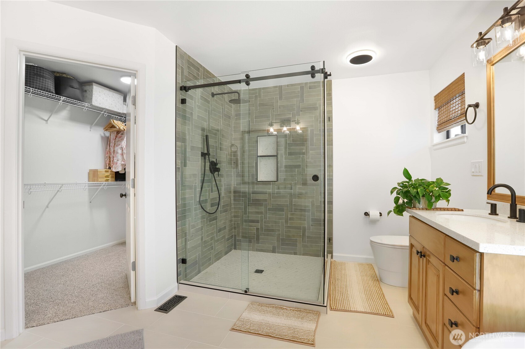 7531 148th Place Southeast Snohomish, WA 98296 - Photo 20 of 29 a bathroom with a shower and a sink mirror