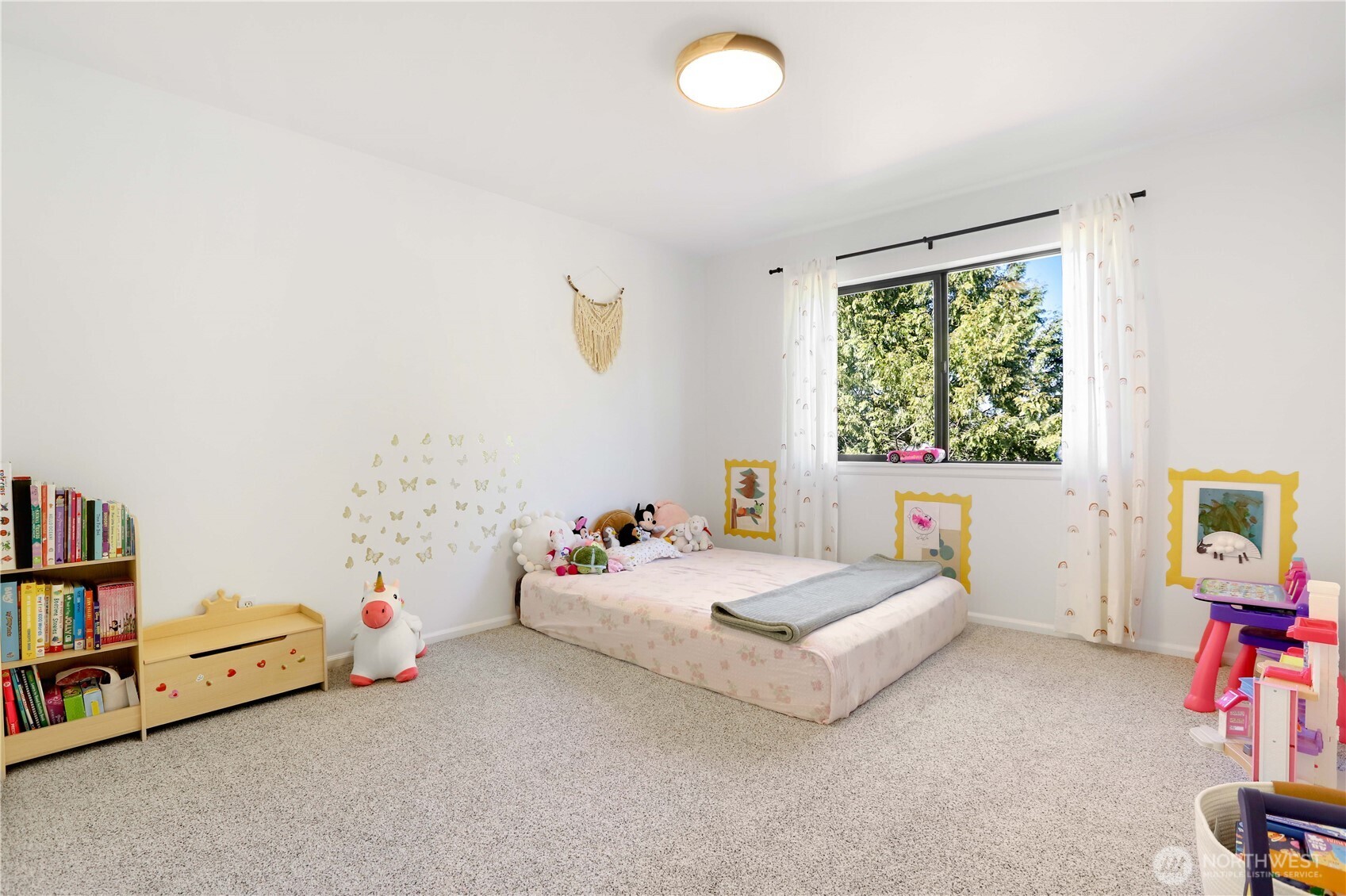 7531 148th Place Southeast Snohomish, WA 98296 - Photo 22 of 29 a spacious bedroom with a bed and a window