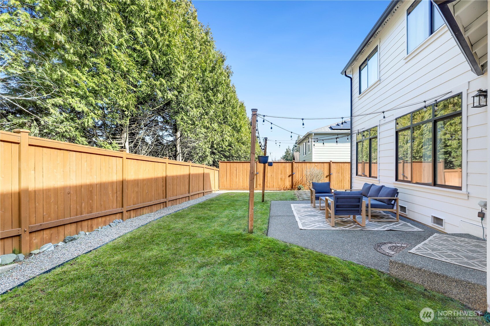 7531 148th Place Southeast Snohomish, WA 98296 - Photo 24 of 29 a view of a two chairs and table in the back yard