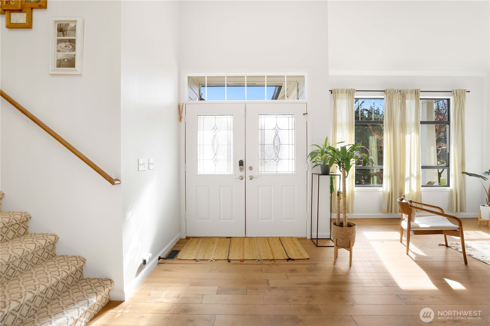 7531 148th Place Southeast Snohomish, WA 98296 - Photo 3 of 29 a view of an entryway with wooden floor