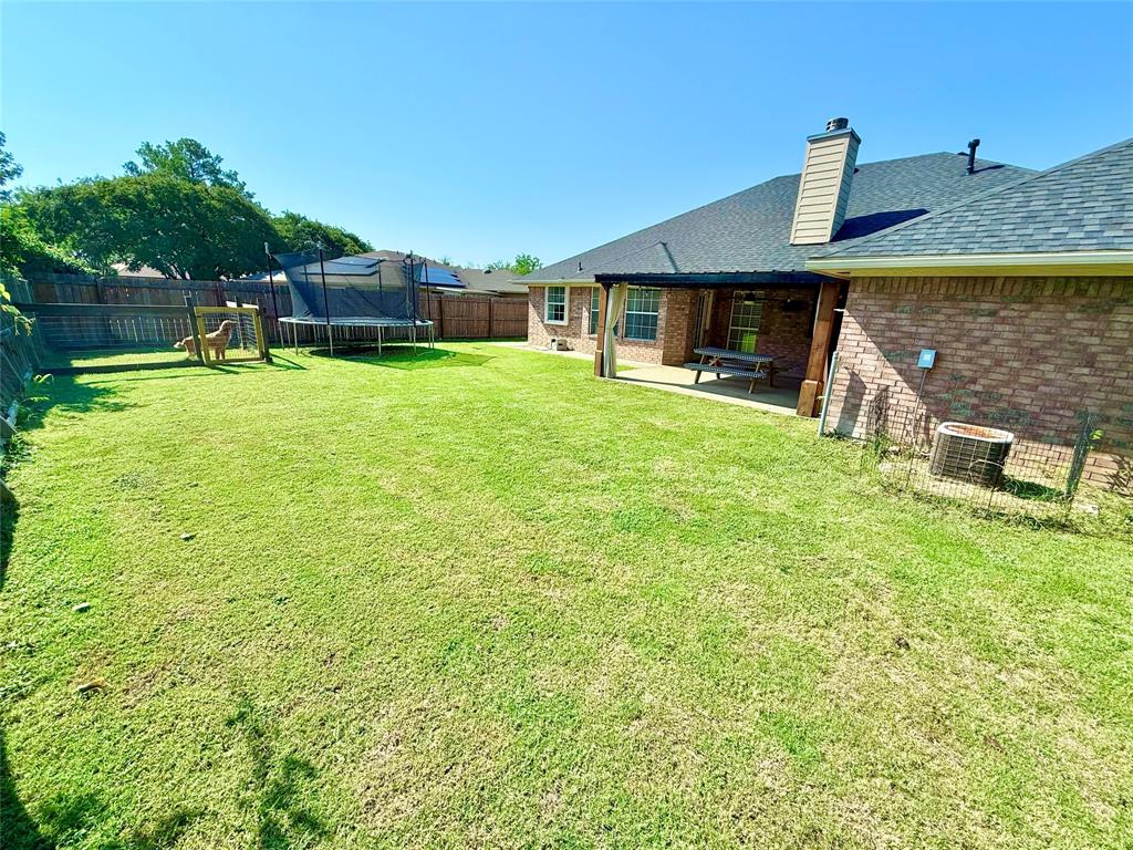 2 Broadmoor Court Bonham, TX 75418 - Photo 15 of 22 a front view of a house with a yard