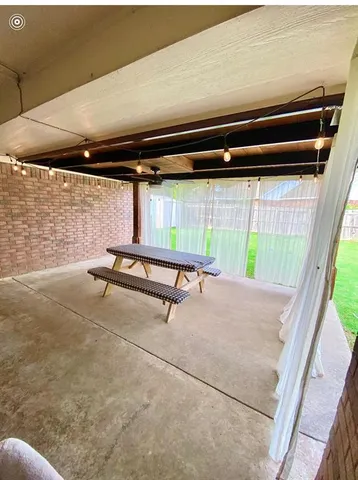 a backyard of a house with seating space