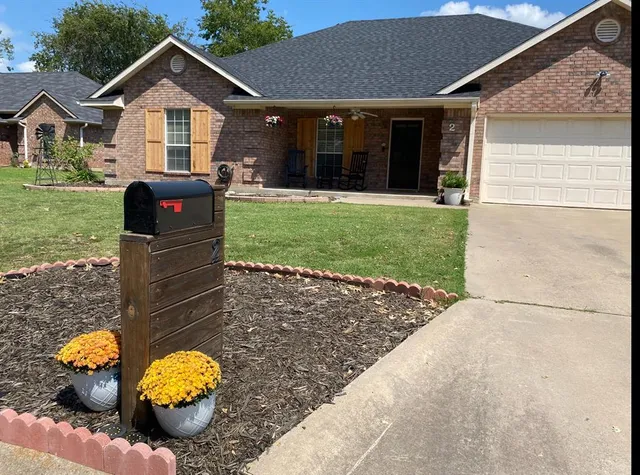 a bedroom with a bed and a mirror