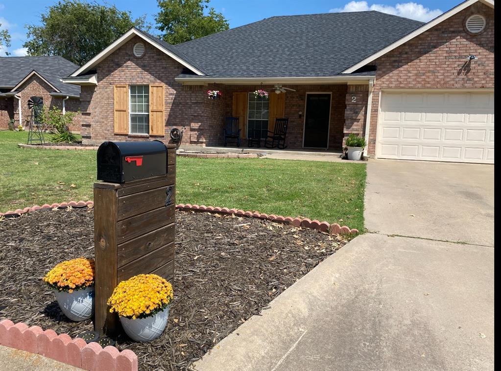 2 Broadmoor Court Bonham, TX 75418 - Photo 20 of 22 a front view of a house with yard