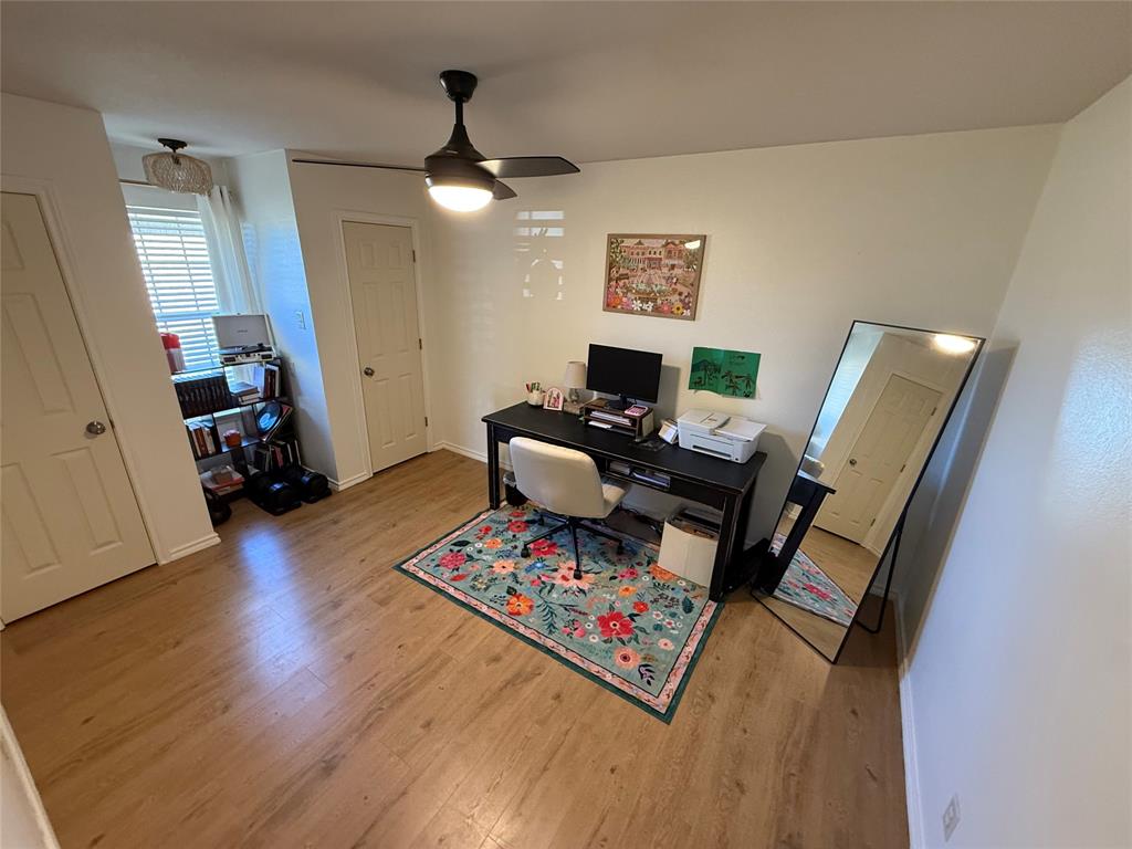 2 Broadmoor Court Bonham, TX 75418 - Photo 22 of 22 a living room with furniture and a wooden floor