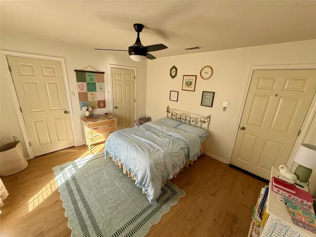 a bedroom with a bed and a mirror