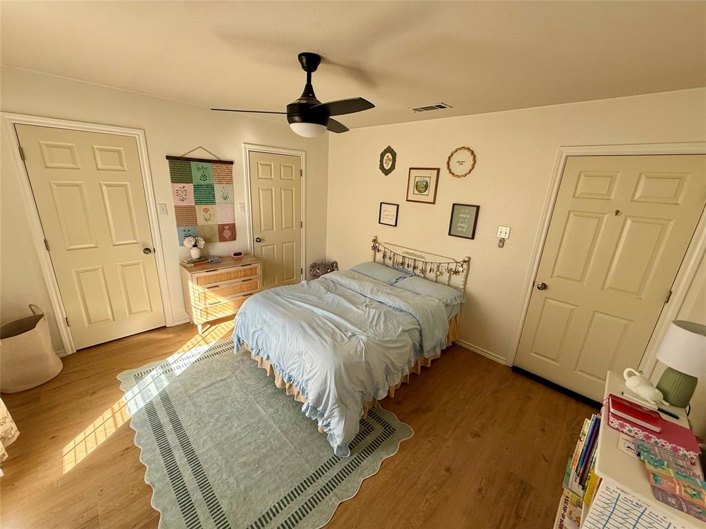2 Broadmoor Court Bonham, TX 75418 - Photo 10 of 22 a bedroom with a bed and a mirror