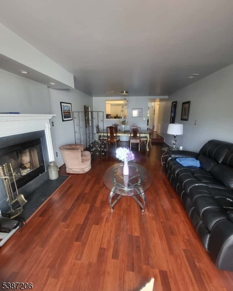 1203 Jesse Way Piscataway, NJ 08854 - Photo 10 of 12 a living room with furniture and a fireplace