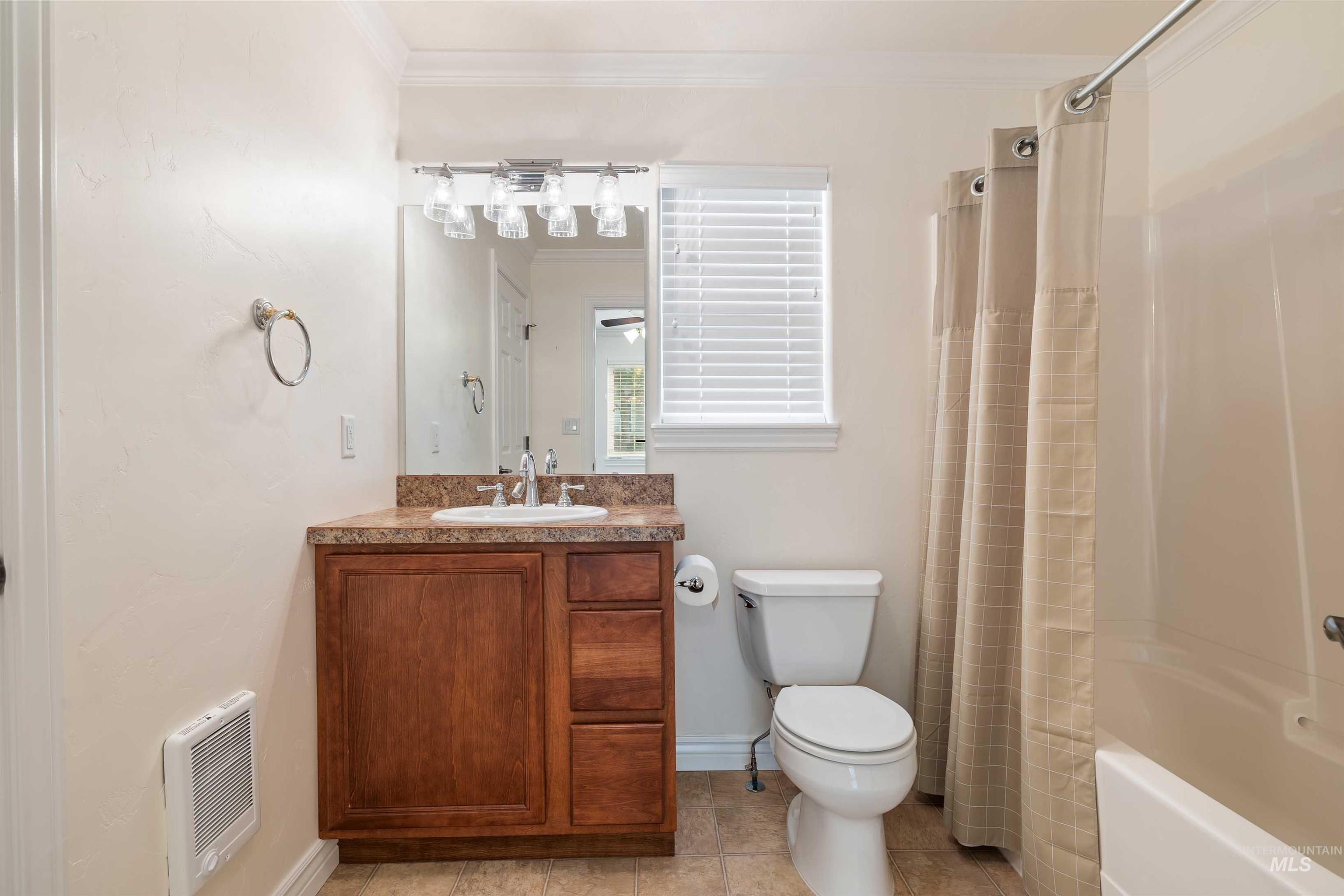3404 Ridge Line Drive Kimberly, ID 83341 - Photo 43 of 50 Bathroom featuring a single vanity with wood-finish cabinetry, a white basin, and a speckled countertop