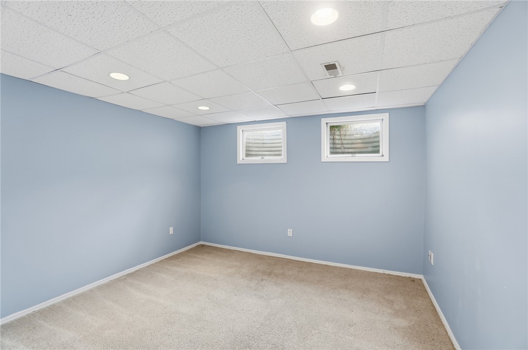 10 Chase Court Springboro, OH 45066 - Photo 57 of 75 This versatile room features warm carpet and soft lighting, ready for your personal touch.