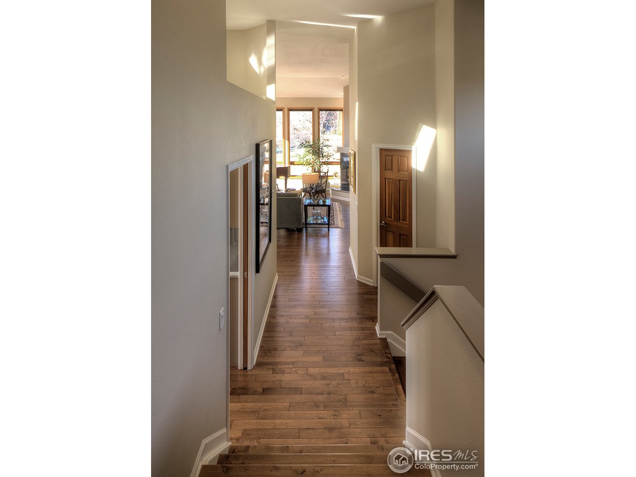 3180 Redstone Road Boulder, CO 80305 - Photo 19 of 24 a view of a hallway with wooden floor