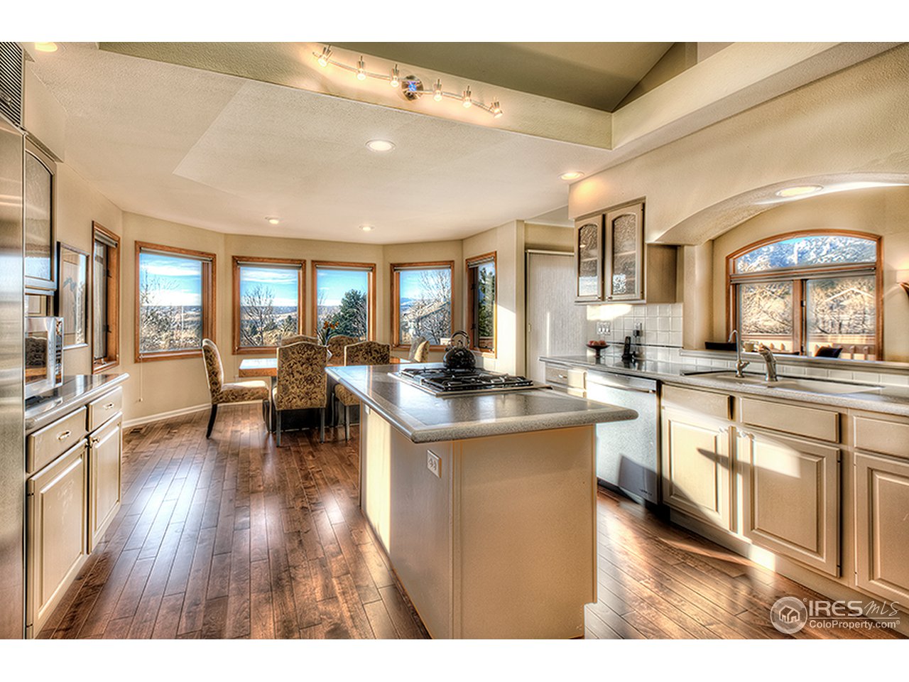 3180 Redstone Road Boulder, CO 80305 - Photo 5 of 24 a open kitchen with stainless steel appliances granite countertop a lot of counter space and a wooden floors