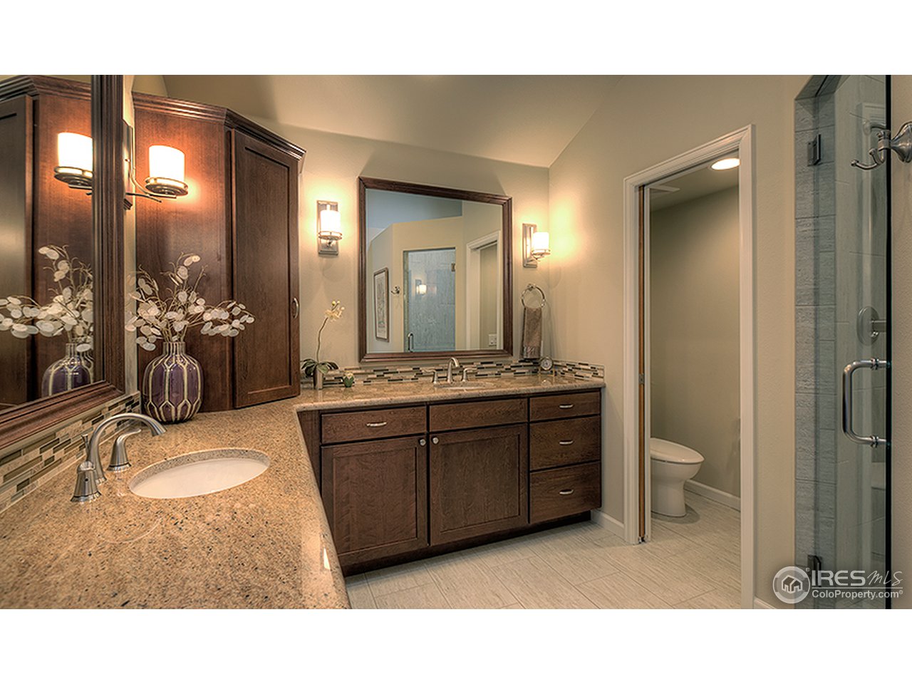 3180 Redstone Road Boulder, CO 80305 - Photo 8 of 24 a bathroom with a sink vanity granite and a mirror