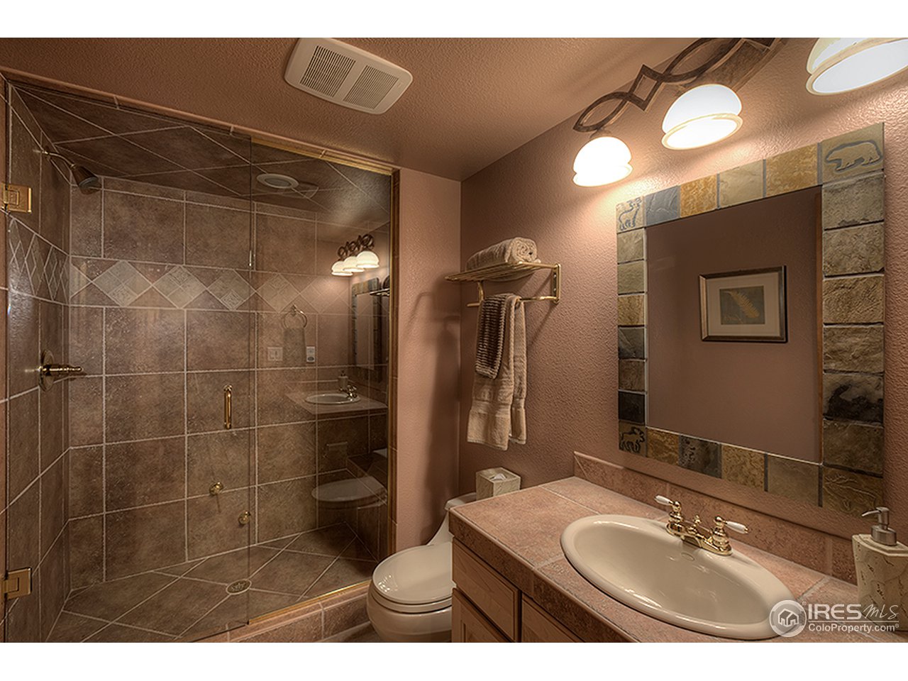 3180 Redstone Road Boulder, CO 80305 - Photo 10 of 24 a bathroom with a sink toilet and shower