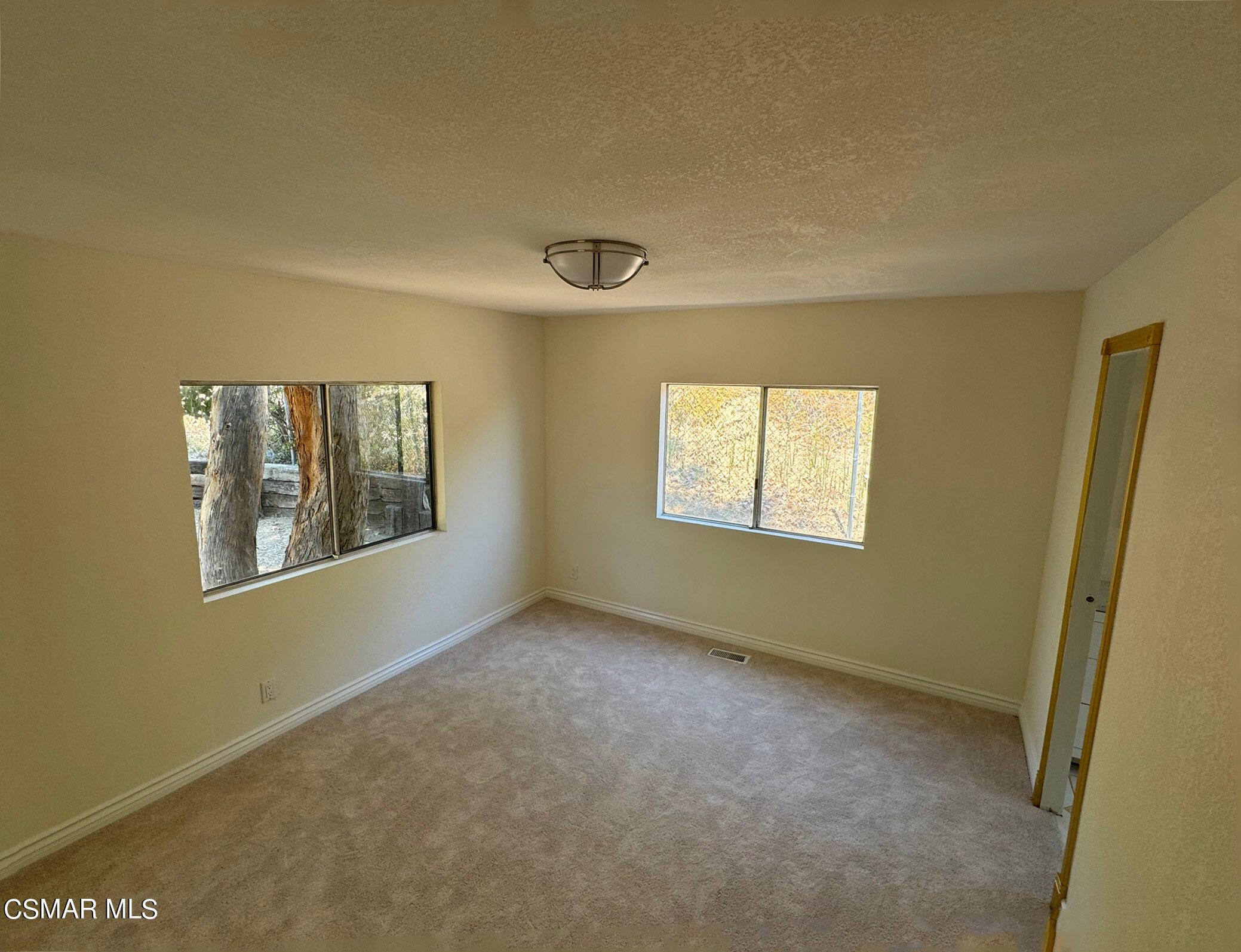 24303 Woolsey Canyon Road, Unit 26 Canoga Park, CA 91304 - Photo 13 of 28 a view of an empty room with a window