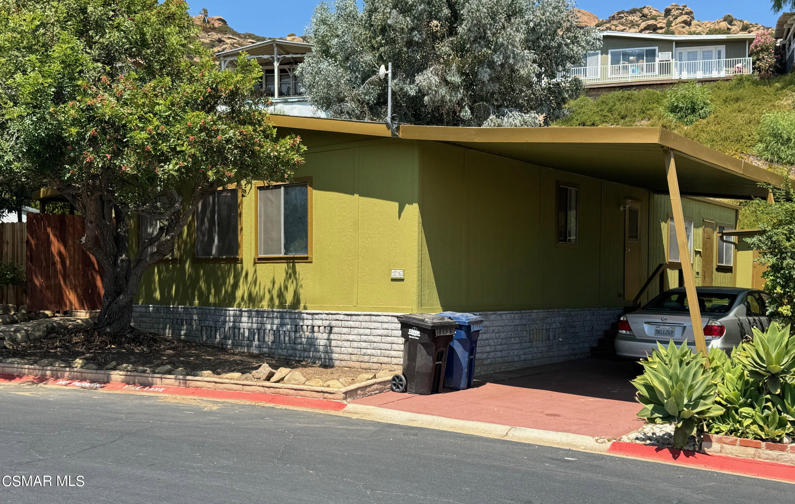 24303 Woolsey Canyon Road, Unit 26 Canoga Park, CA 91304 - Photo 2 of 28 a view of a house with a yard